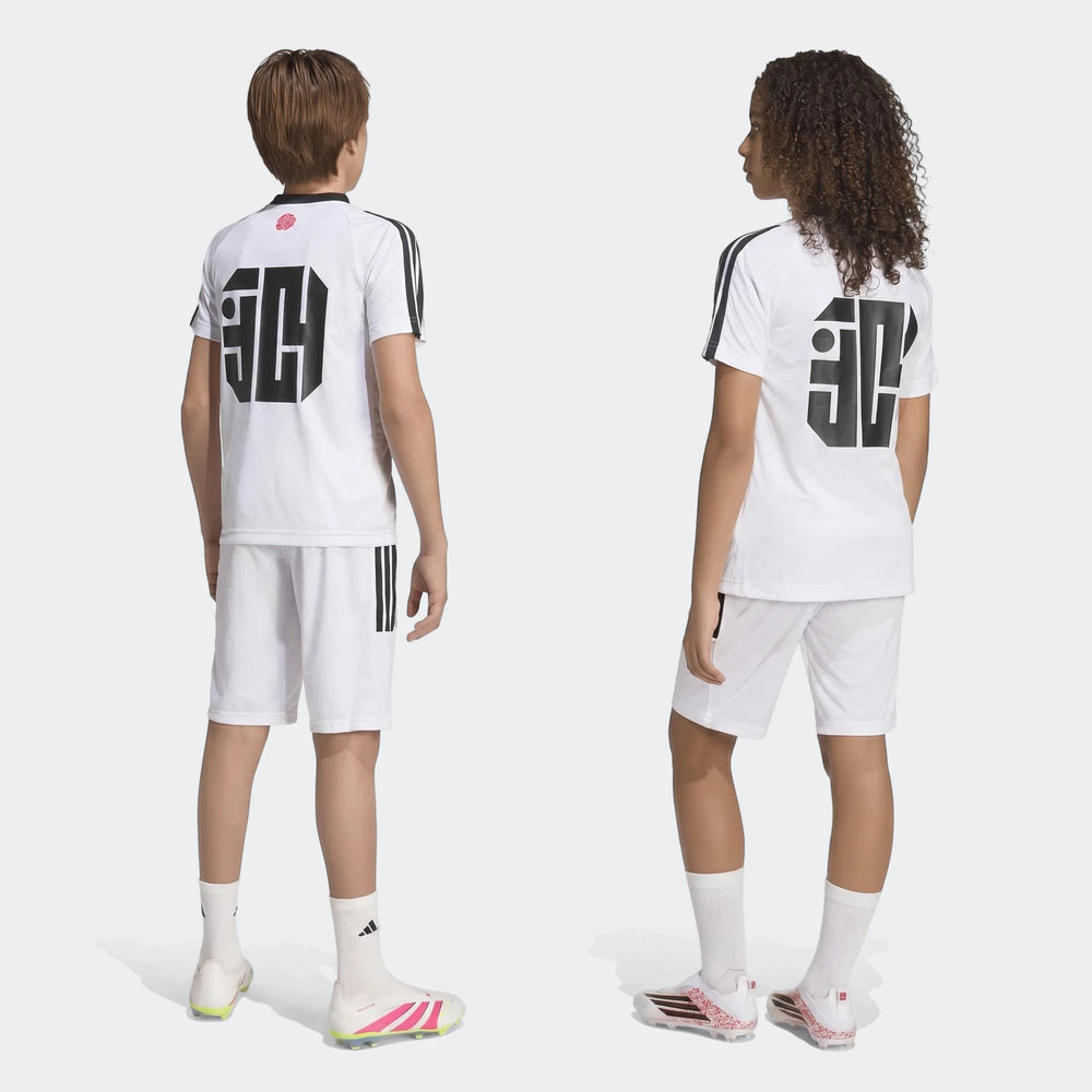 Two youths wearing white Lamine Yamal Hot Shorts Youth and matching football jerseys from behind on a plain background.