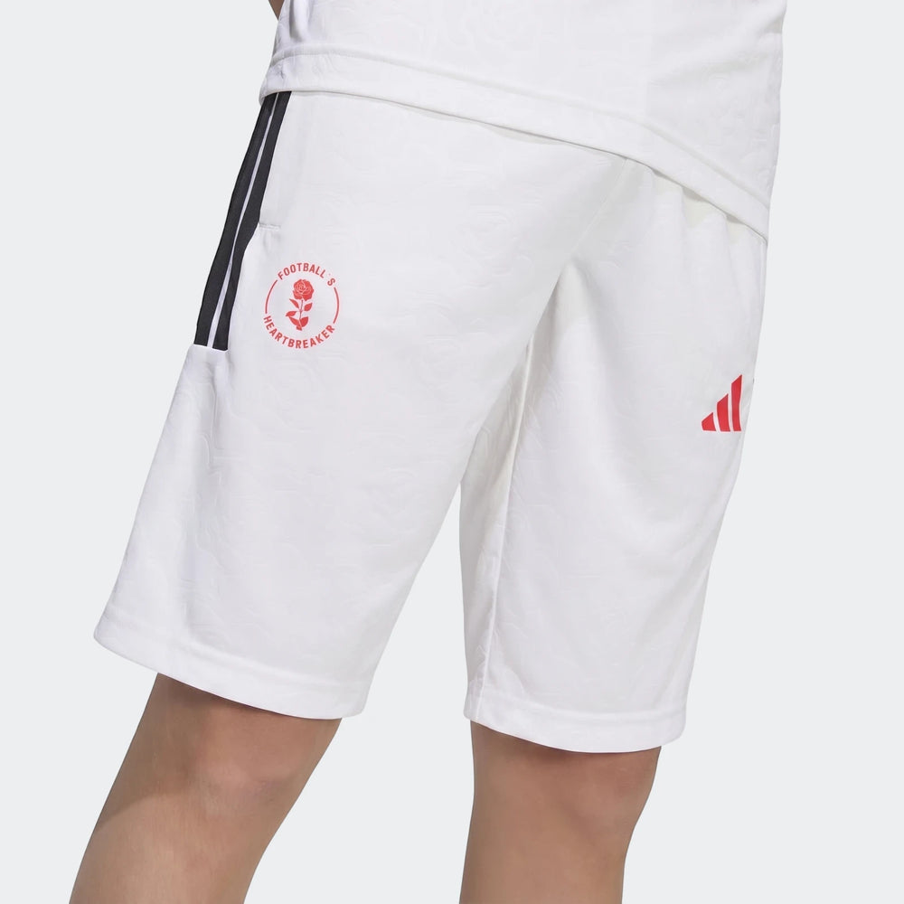 Close-up of Lamine Yamal Hot Shorts Youth in white, featuring red Football's Heartbreaker graphic and black stripes, worn by