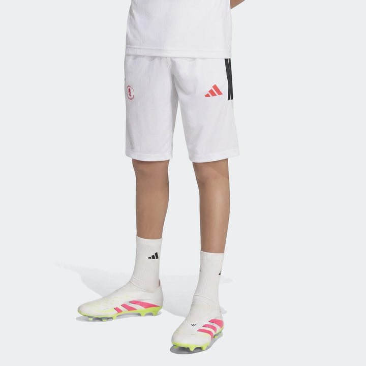Youth Lamine Yamal Hot Shorts in white, styled with white socks and white, pink, and lime green football cleats.