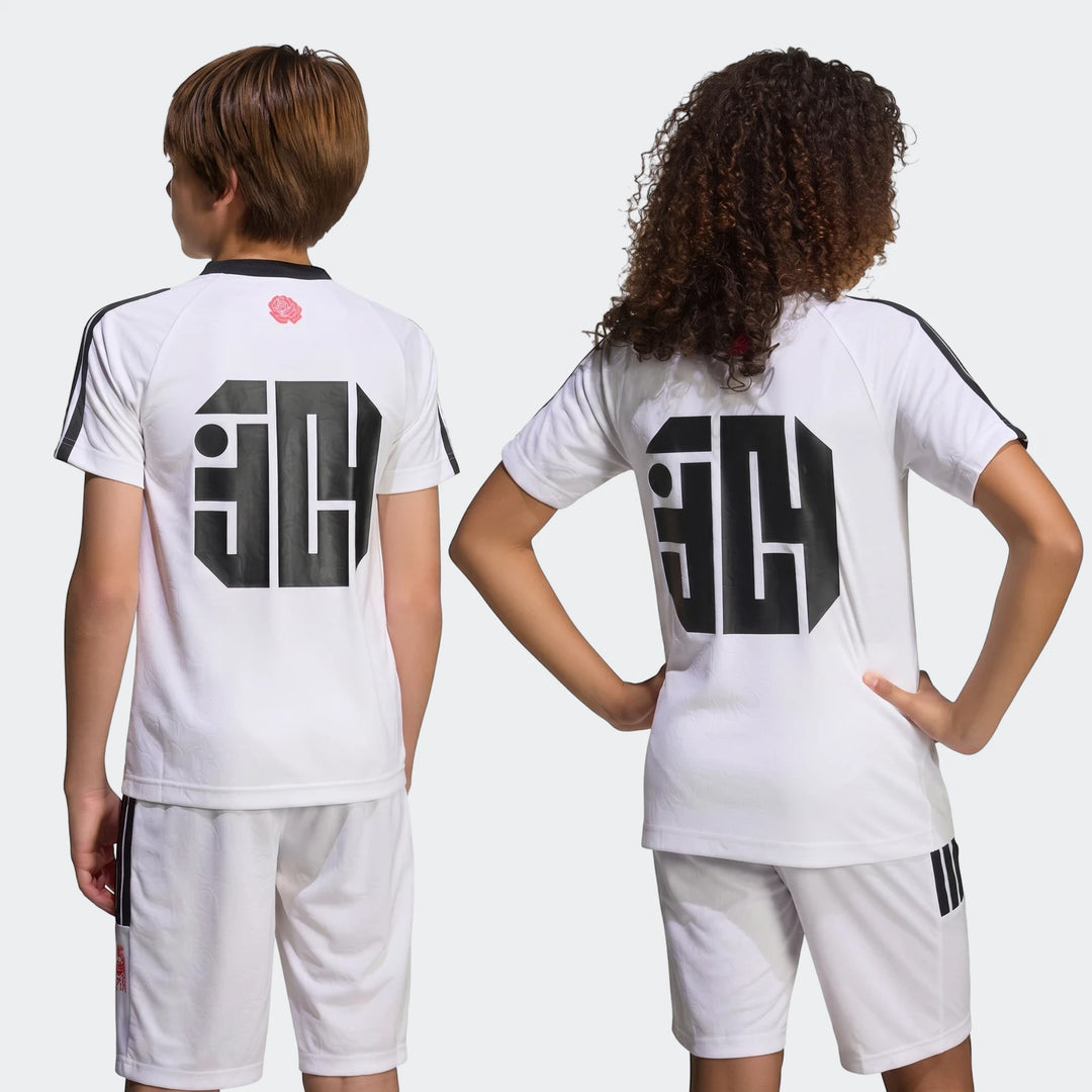 Two kids from behind, wearing white Lamine Yamal training t-shirts and shorts with black stripes and a '30' logo.