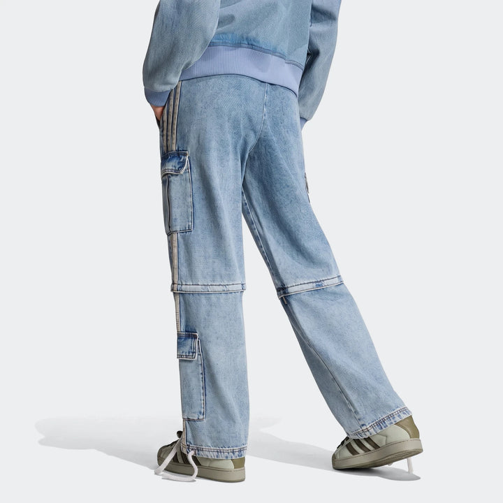 Rear-side view of a person wearing light blue mid-rise 2-in-1 denim cargo pants with side stripes and sneakers.