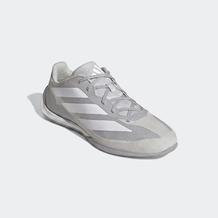 Light gray Adidas Feroza Base Shoes with white stripes, visible from a side angle, designed for athletic performance.