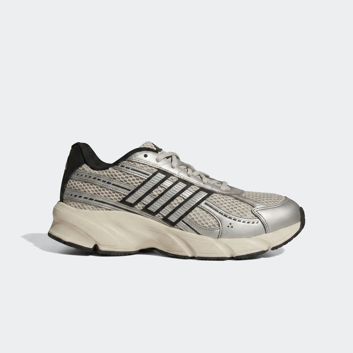 Light grey and black athletic running shoe with mesh and metallic silver accents, designed for training and comfort.