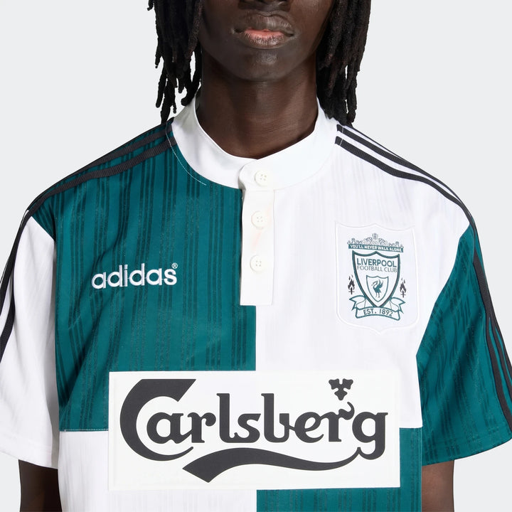 Liverpool Fc 1995 Away Jersey, featuring a distinctive half teal striped and half white design with Adidas and Carlsberg