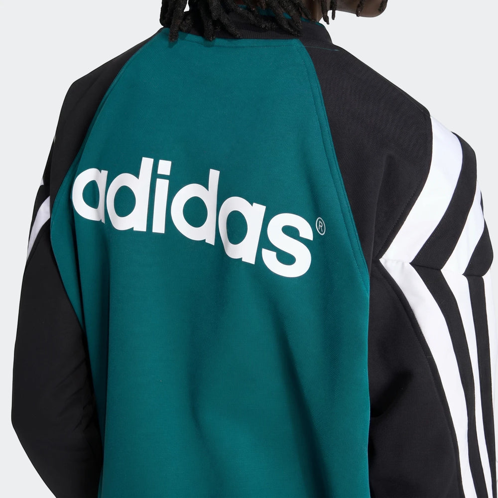 Liverpool Fc 1995 Sweatshirt in black and teal, featuring a large white Adidas logo on the back, worn by a model.