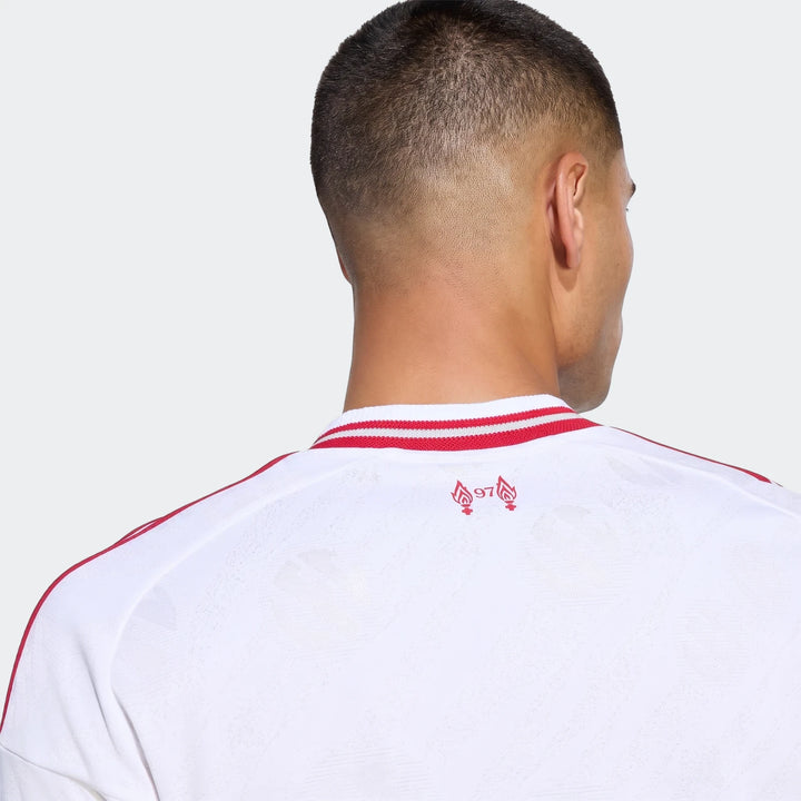 Liverpool FC 26/27 Away Authentic Jersey Longsleeve in white with red trim, worn by a man viewed from the back.