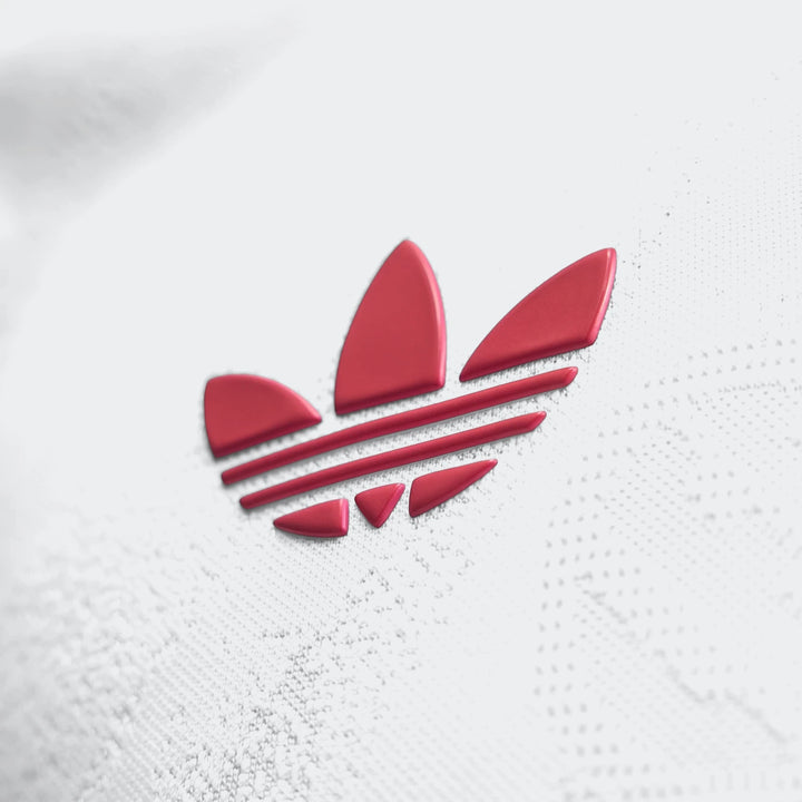 Close-up of the red Adidas trefoil logo embossed on the white textured fabric of the Liverpool FC 26/27 Away Authentic