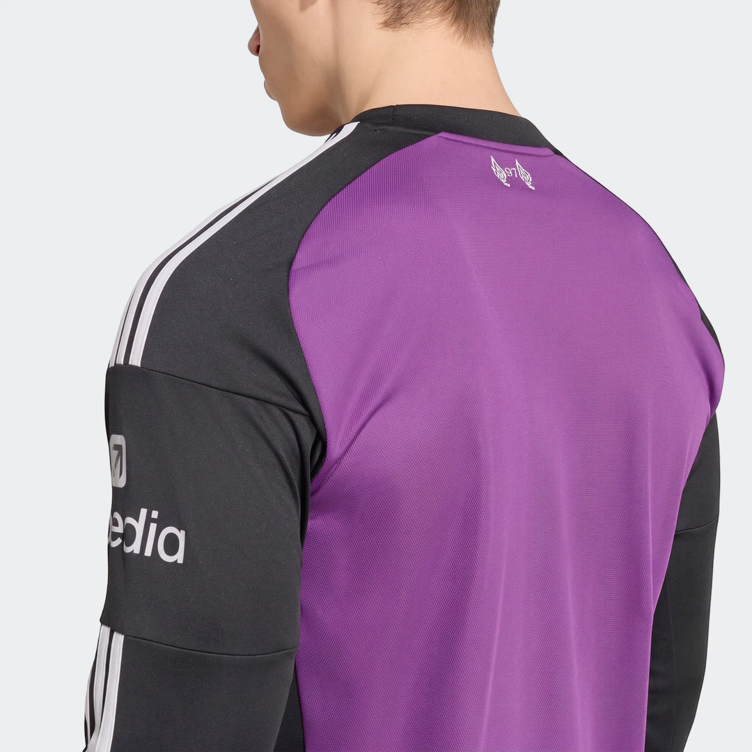 Liverpool Fc 26/27 Away Goalkeeper Jersey in purple and black, featuring white stripes and logos, worn by a person from the