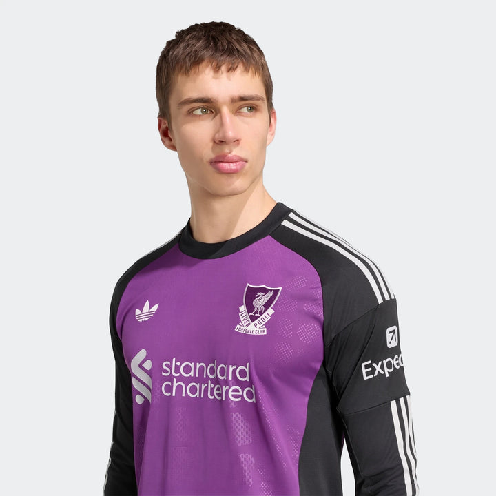 Male model wearing a Liverpool FC 26/27 Away Goalkeeper Jersey, featuring purple and black design with club crest and