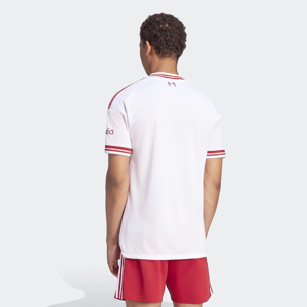 Liverpool FC 26/27 Away Authentic Jersey, white and red, worn by a male model from the back, paired with red shorts.
