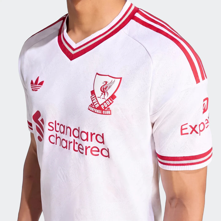 Authentic Liverpool FC 26/27 Away Jersey, white with red stripes and sponsor logos, displayed on a person.