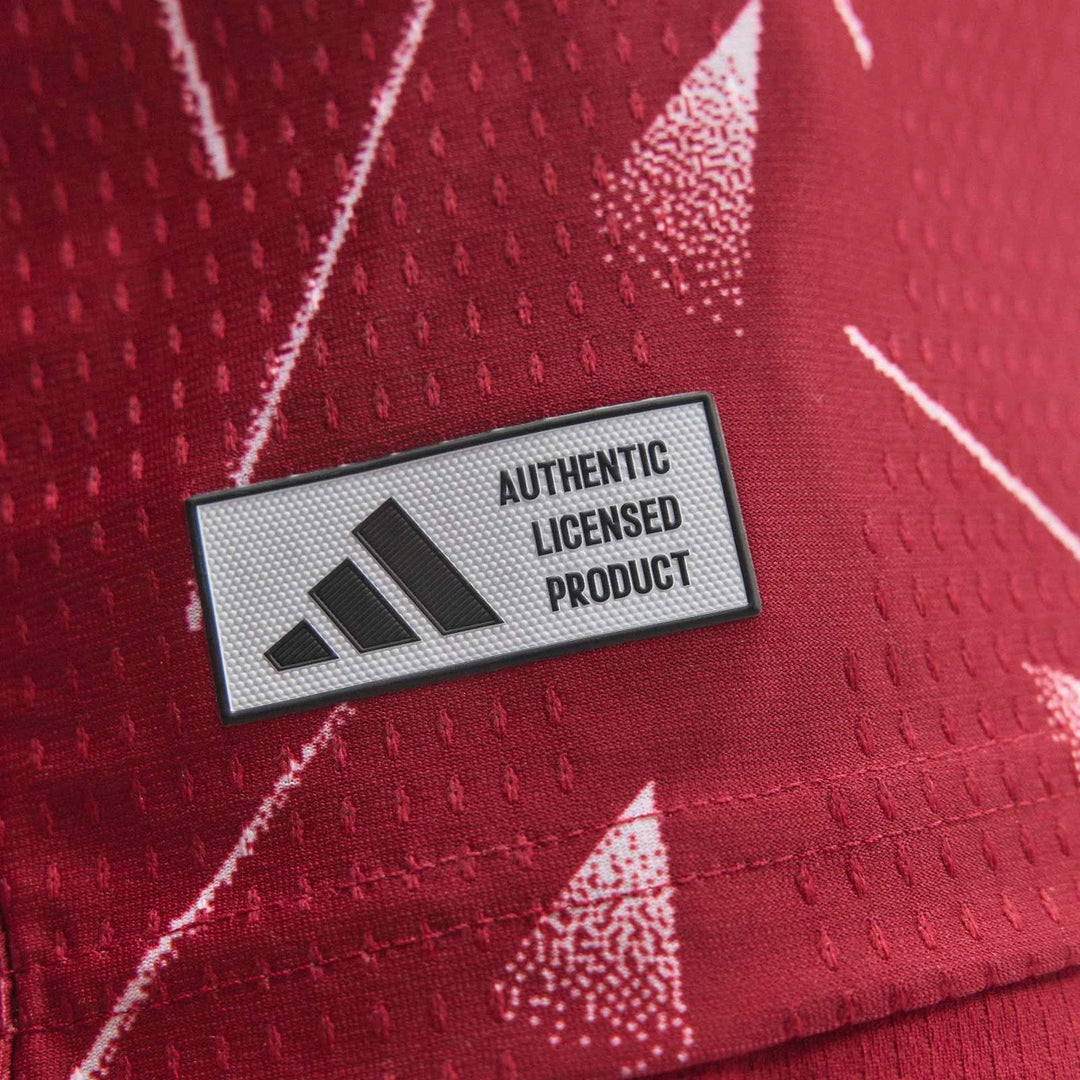 Liverpool FC 26/27 Home Authentic Jersey Longsleeve in red, close-up of textured fabric with authentic licensed product badge