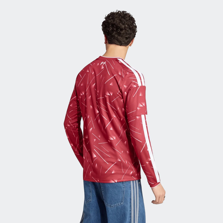 Liverpool Fc 26/27 Home Jersey Long Sleeve. A male model wears a red and white patterned long-sleeve jersey with Adidas