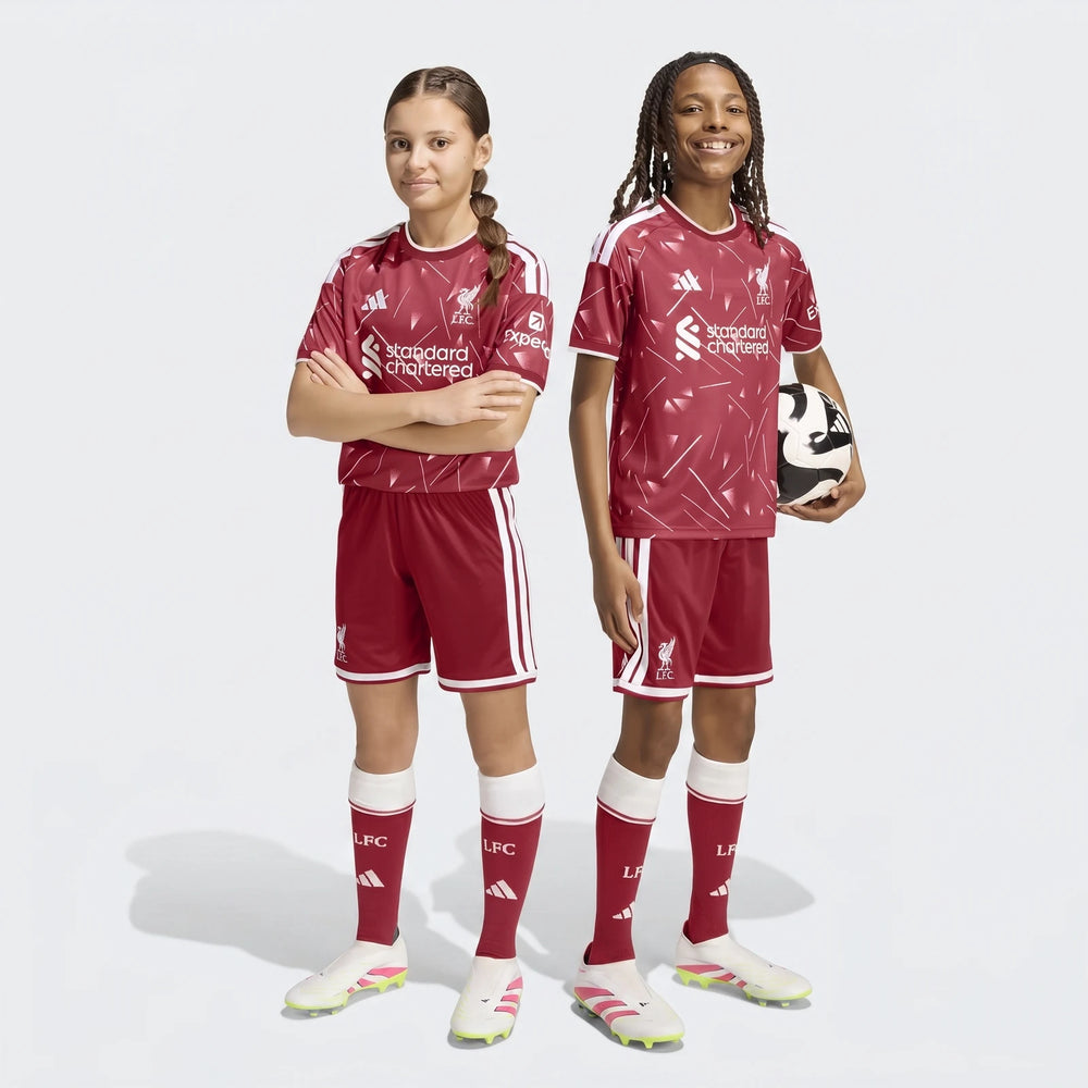 Liverpool FC 26/27 Home Shorts Kids in deep red with white side stripes and LFC crest, shown front view.