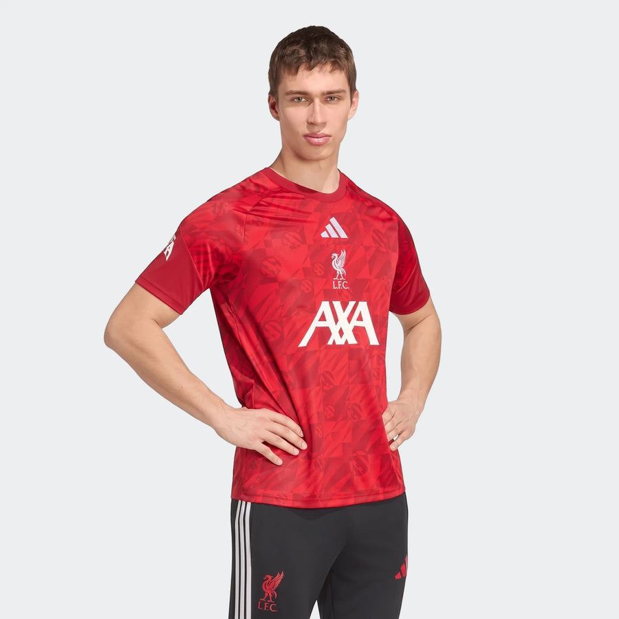 Men's red Liverpool FC 26/27 Pre Match Jersey worn by a model, featuring Adidas logo and AXA sponsor.