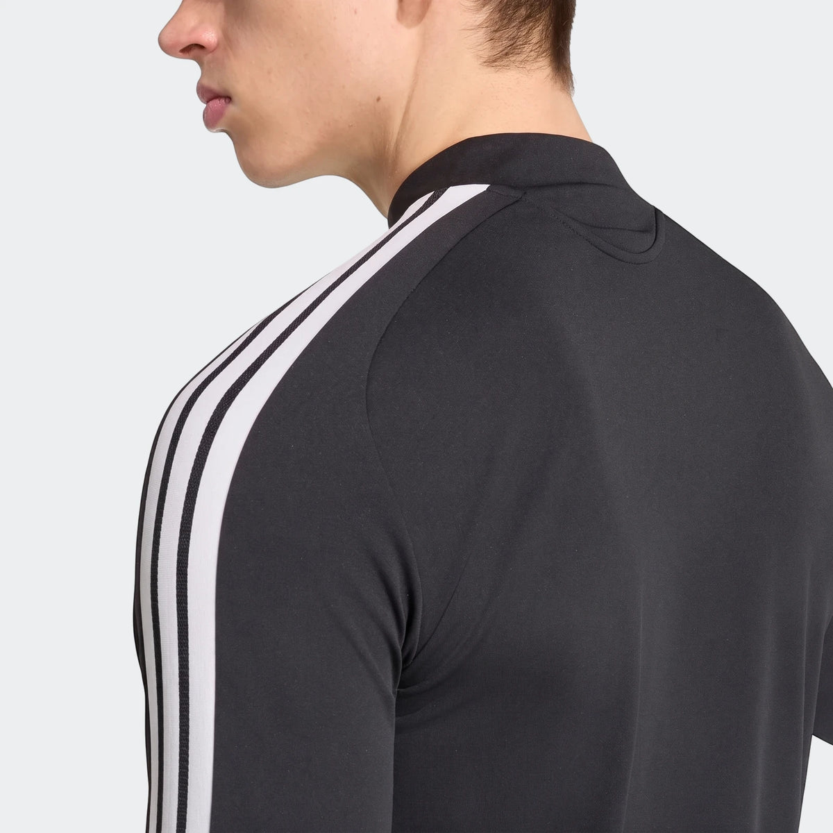 Men's Liverpool FC 26/27 Tiro training top in black with white 3-stripes on the shoulder, viewed from the back-left.