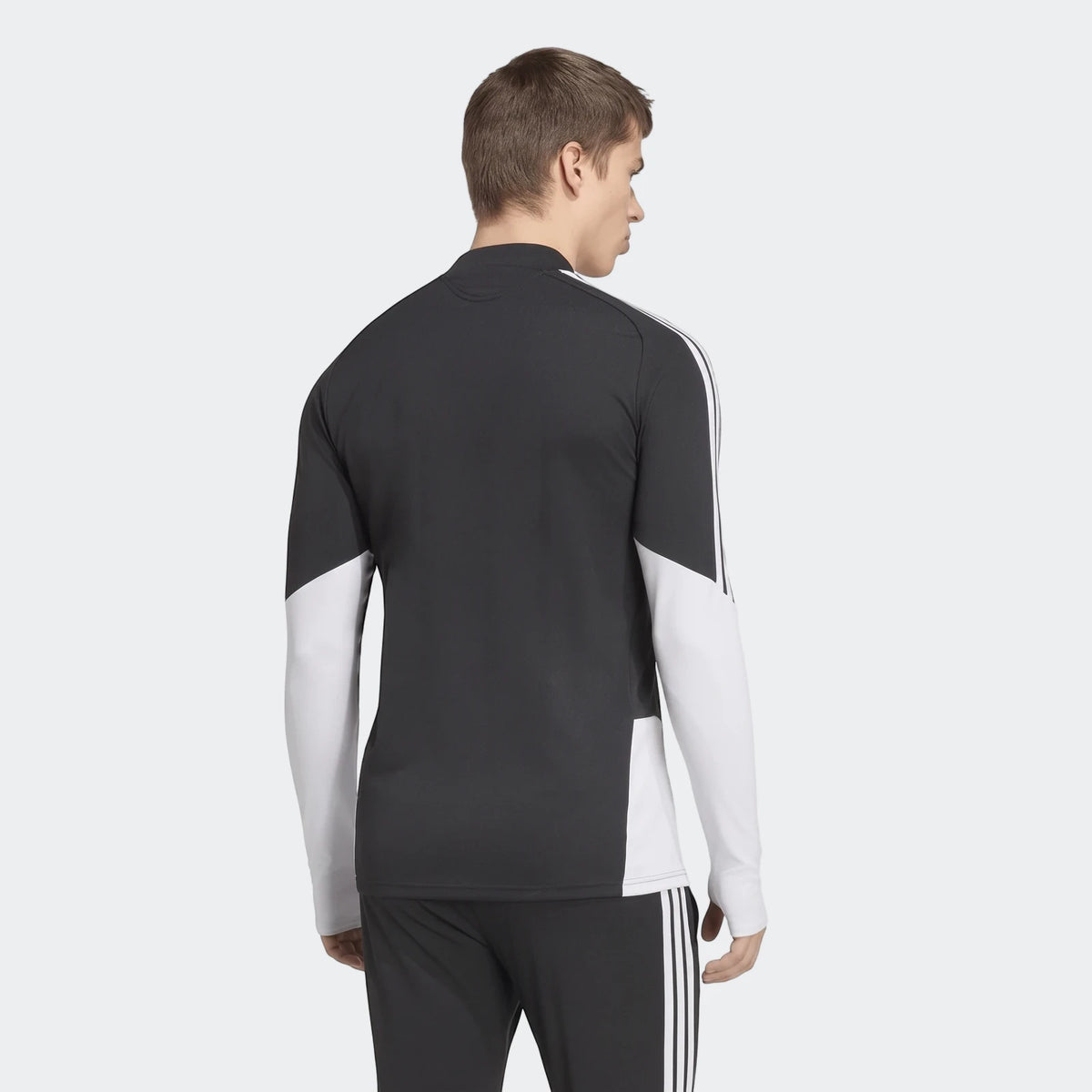 Men's black and white Liverpool FC 26/27 Tiro Training Top, long-sleeve, shown from the back with three stripes.