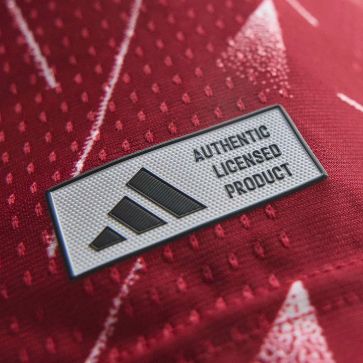 Close-up of Liverpool FC 26/27 Home Jersey Authentic in red fabric showing the authentic licensed product patch