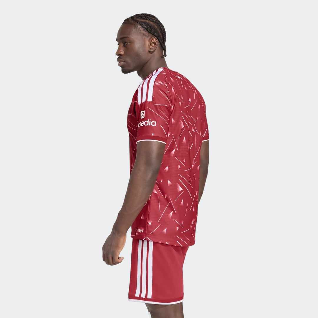 Liverpool FC 26/27 Home Jersey Authentic in red with white shoulder stripes, side view showing patterned back panel.