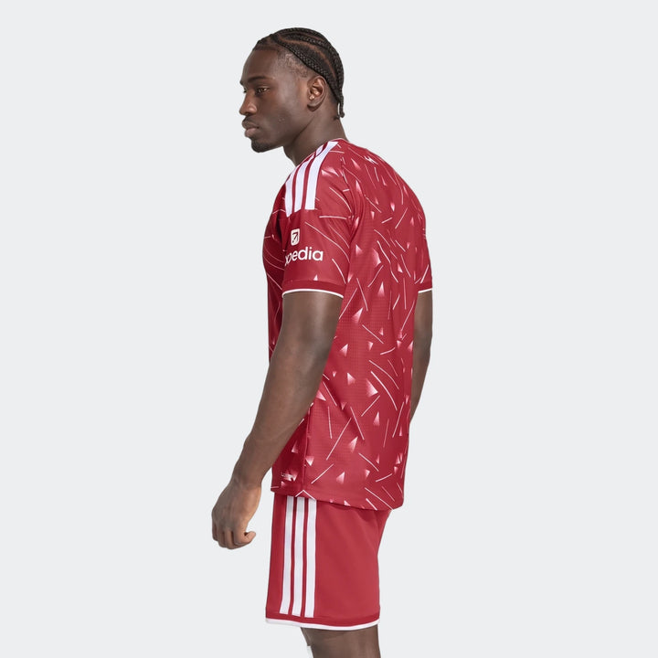 Liverpool FC 26/27 Home Jersey Authentic in red with white shoulder stripes, side view showing patterned back panel.
