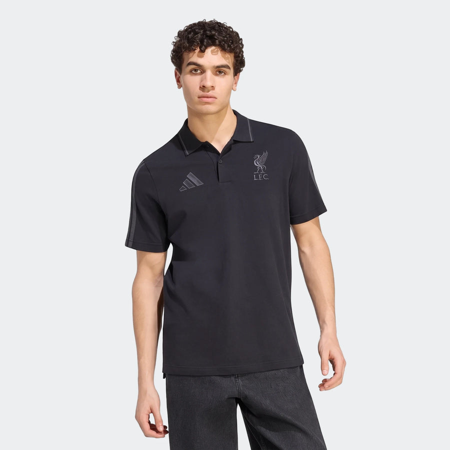 Men's black Adidas Liverpool FC DNA short-sleeve polo shirt with club crest and Adidas logo, worn by a model.