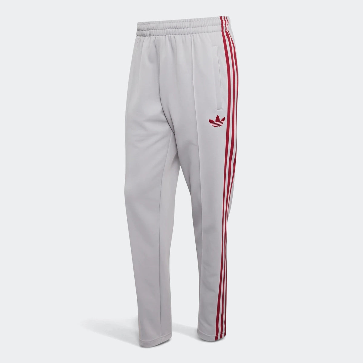 Light gray Adidas Liverpool FC Originals Track Pants with red three stripes and Trefoil logo, shown on a white background.