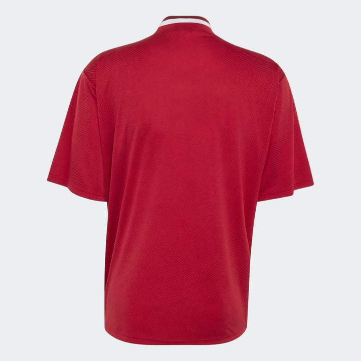 Back view of Liverpool FC Street Jersey in red textured fabric with short sleeves and a white striped collar.