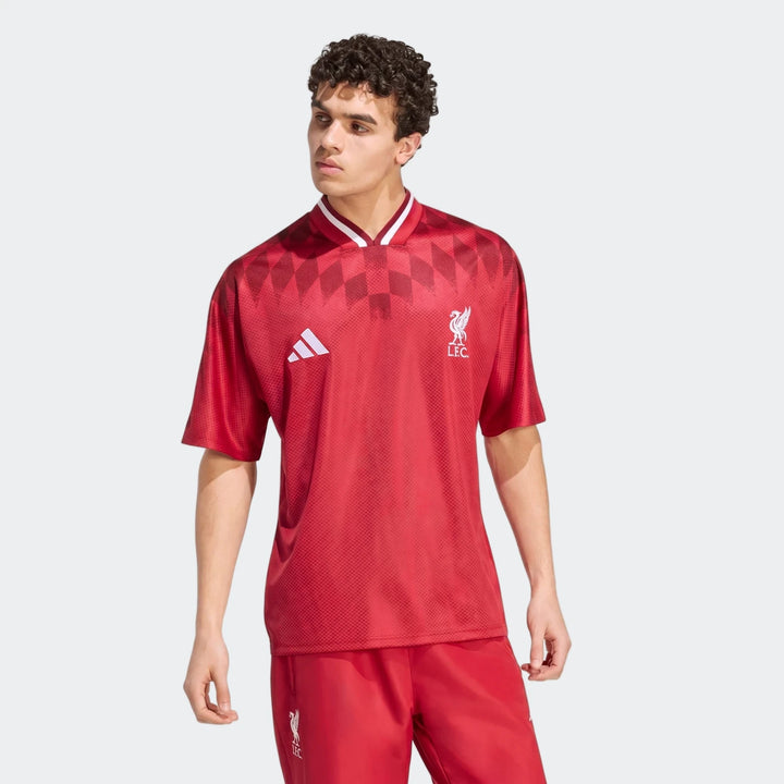 Liverpool FC Street Jersey in red with short sleeves, V-neck collar, and LFC crest on the chest, front view.