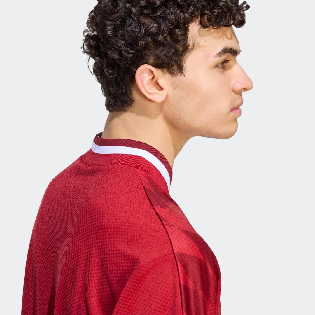 Liverpool FC Street Jersey in red with white striped collar, side profile view showing textured knit fabric.