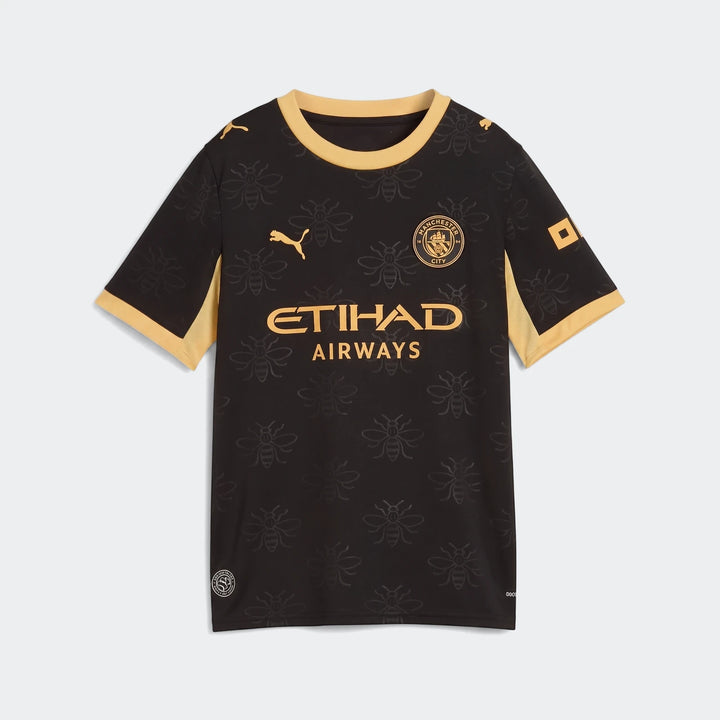 Youth Manchester City 26/27 Away Jersey in black and gold with a subtle bee pattern and sponsor logos.