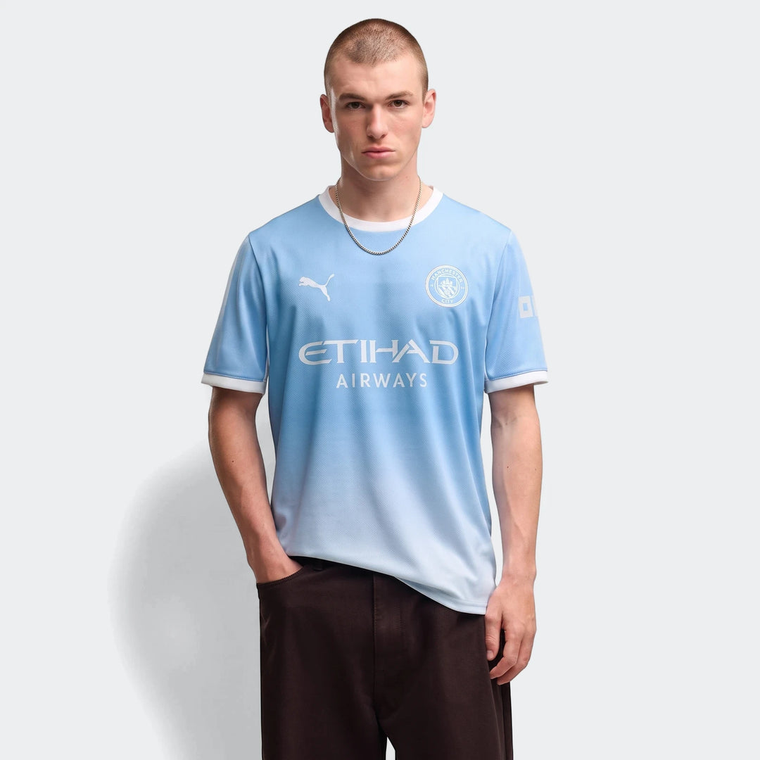 Manchester City 26/27 Home Jersey for men, light blue with white accents, worn by a male model.