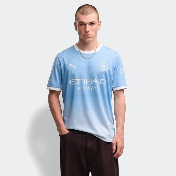 Manchester City 26/27 Home Jersey for men, light blue with white accents, worn by a male model.