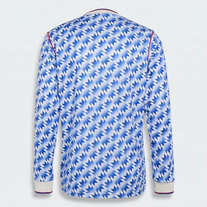 Back view of Manchester United 1990 long sleeve away jersey in blue and white zigzag pattern.