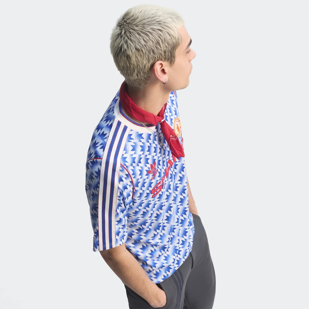 Manchester United 1990 Away Jersey in blue and white geometric print, short-sleeve football shirt side view