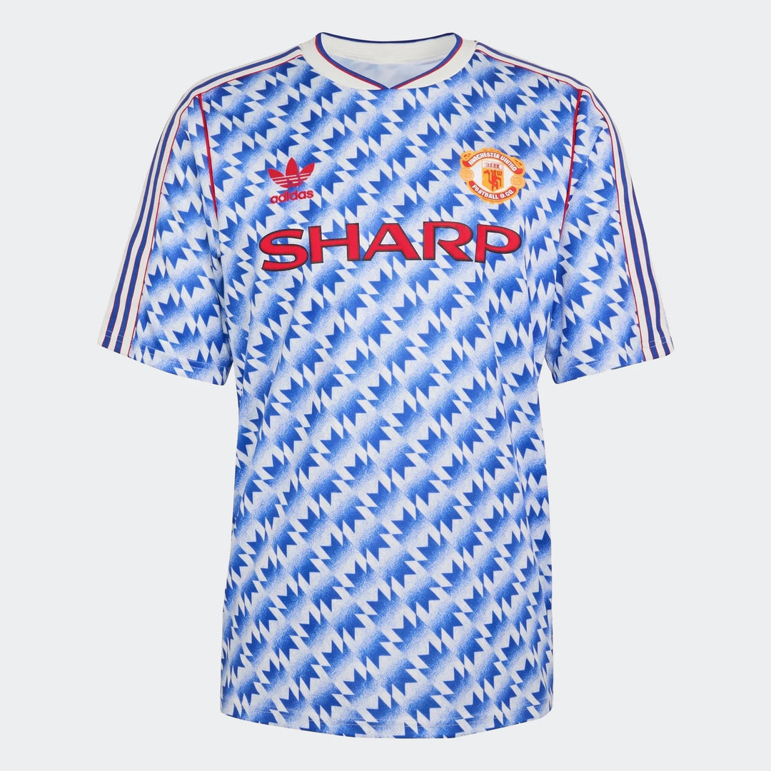 Manchester United 1990 away jersey in blue and white zigzag pattern, short sleeves, front view with crest.