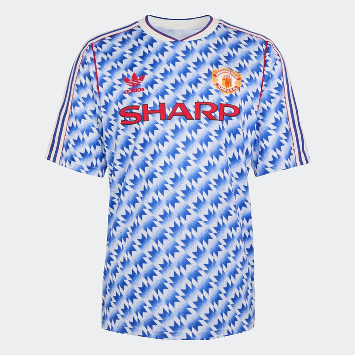 Manchester United 1990 away jersey in blue and white zigzag pattern, short sleeves, front view with crest.