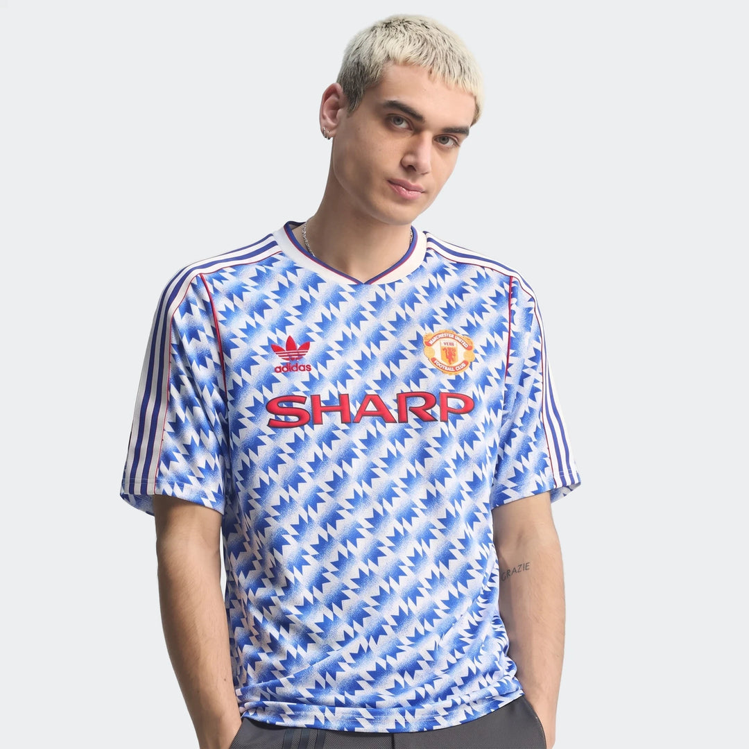 Manchester United 1990 Away Jersey in blue and white zigzag pattern, short sleeve front view with club crest.