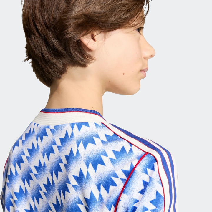 Manchester United 1990 Away Jersey Kids in blue and white geometric print, rear shoulder view with striped collar trim