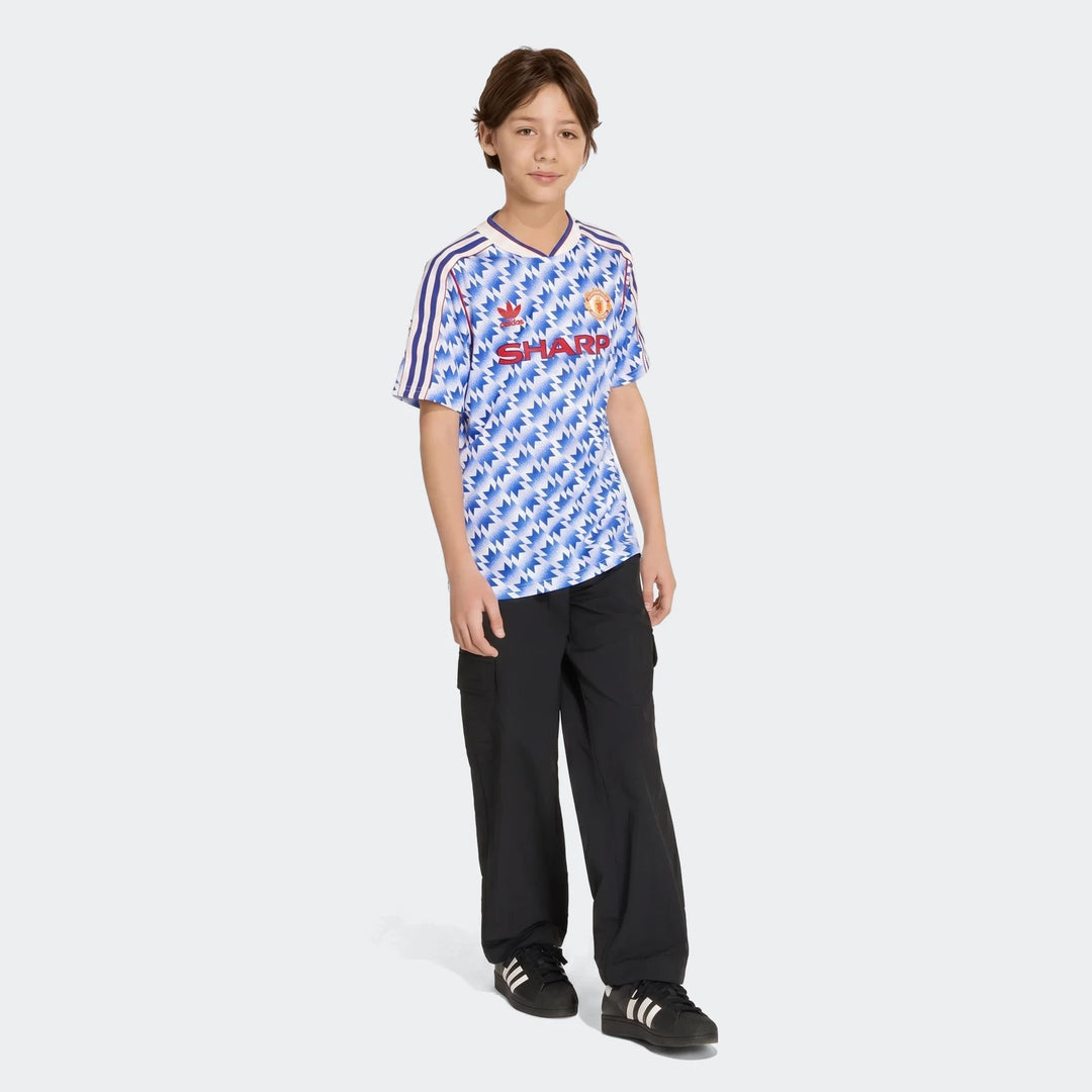 Manchester United 1990 Away Jersey Kids in blue and white zigzag pattern, short sleeve football shirt front view