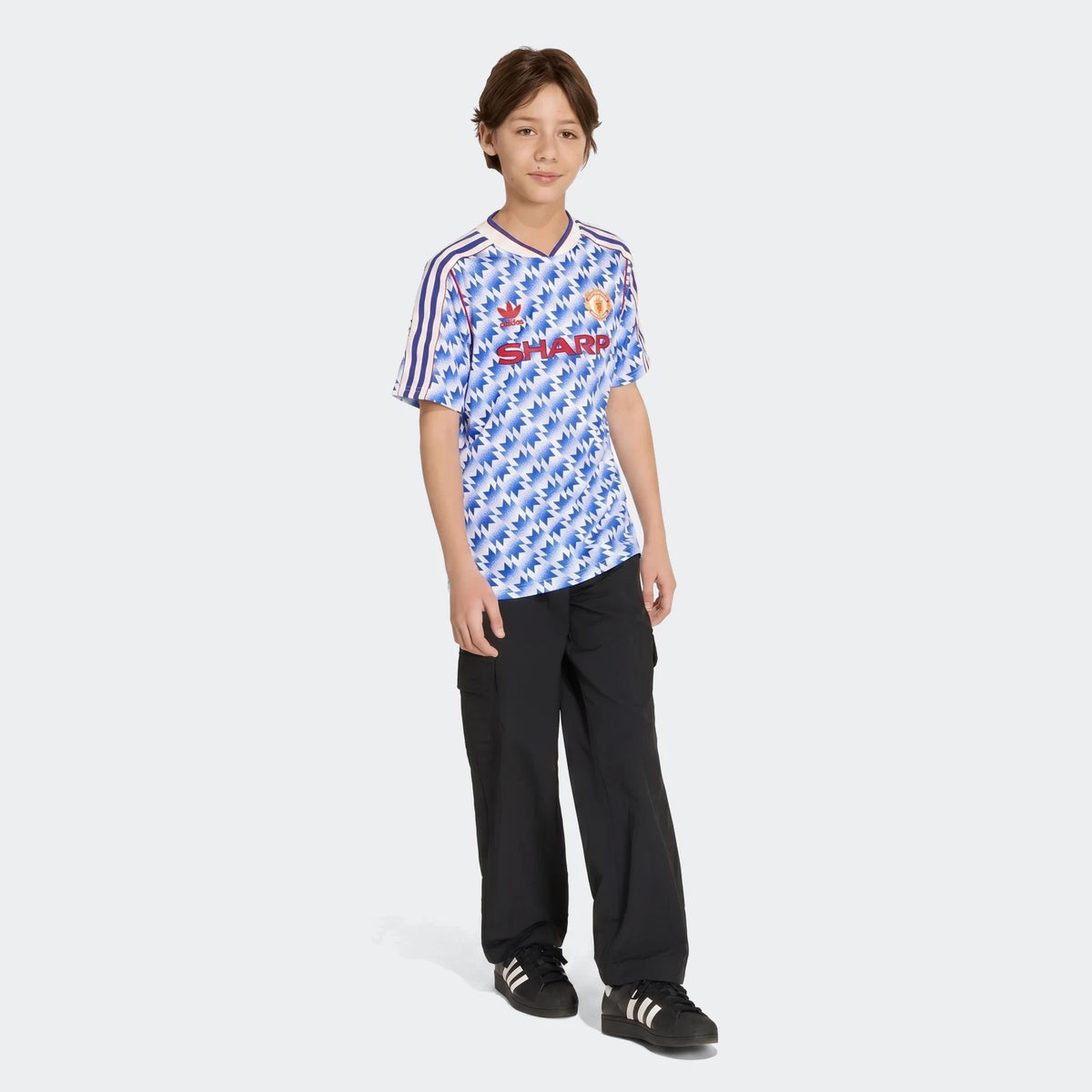 Manchester United 1990 Away Jersey Kids in blue and white zigzag pattern, short sleeve football shirt front view