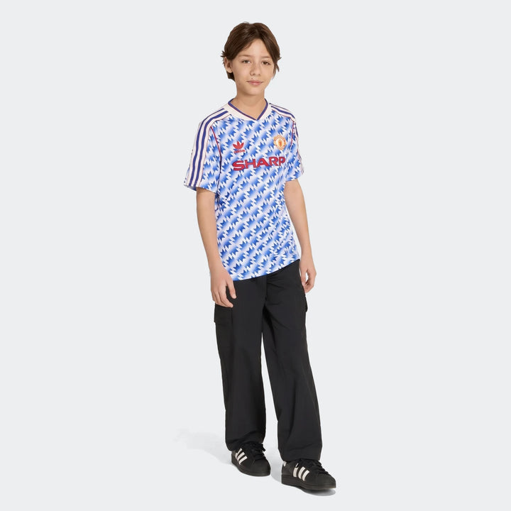Manchester United 1990 Away Jersey Kids in blue and white zigzag pattern, short sleeve football shirt front view