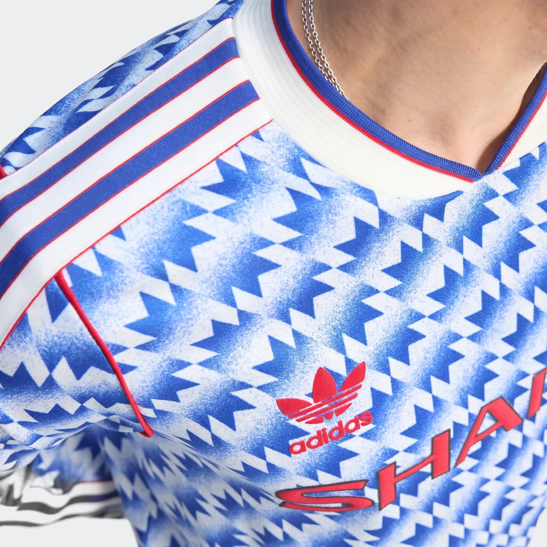 Manchester United 1990 Long Sleeve Away Jersey close-up with blue and white geometric print and V-neck collar