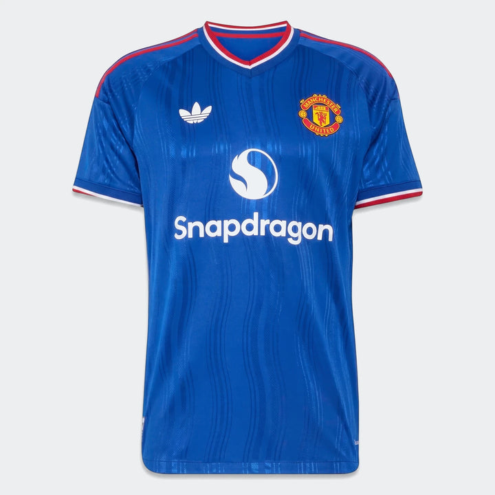 Manchester United 26/27 Authentic Away Jersey in blue, featuring the Adidas logo, club crest, and Snapdragon sponsor.