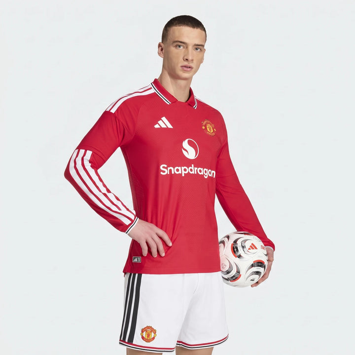 Manchester United 26/27 Authentic Long Sleeve Home Jersey in red, front view with club crest and white sleeve stripes.
