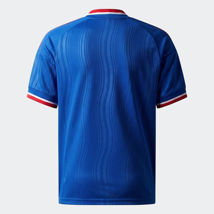 Back view of a kids' Manchester United 26/27 Away Jersey in blue with red and white striped collar and cuffs.