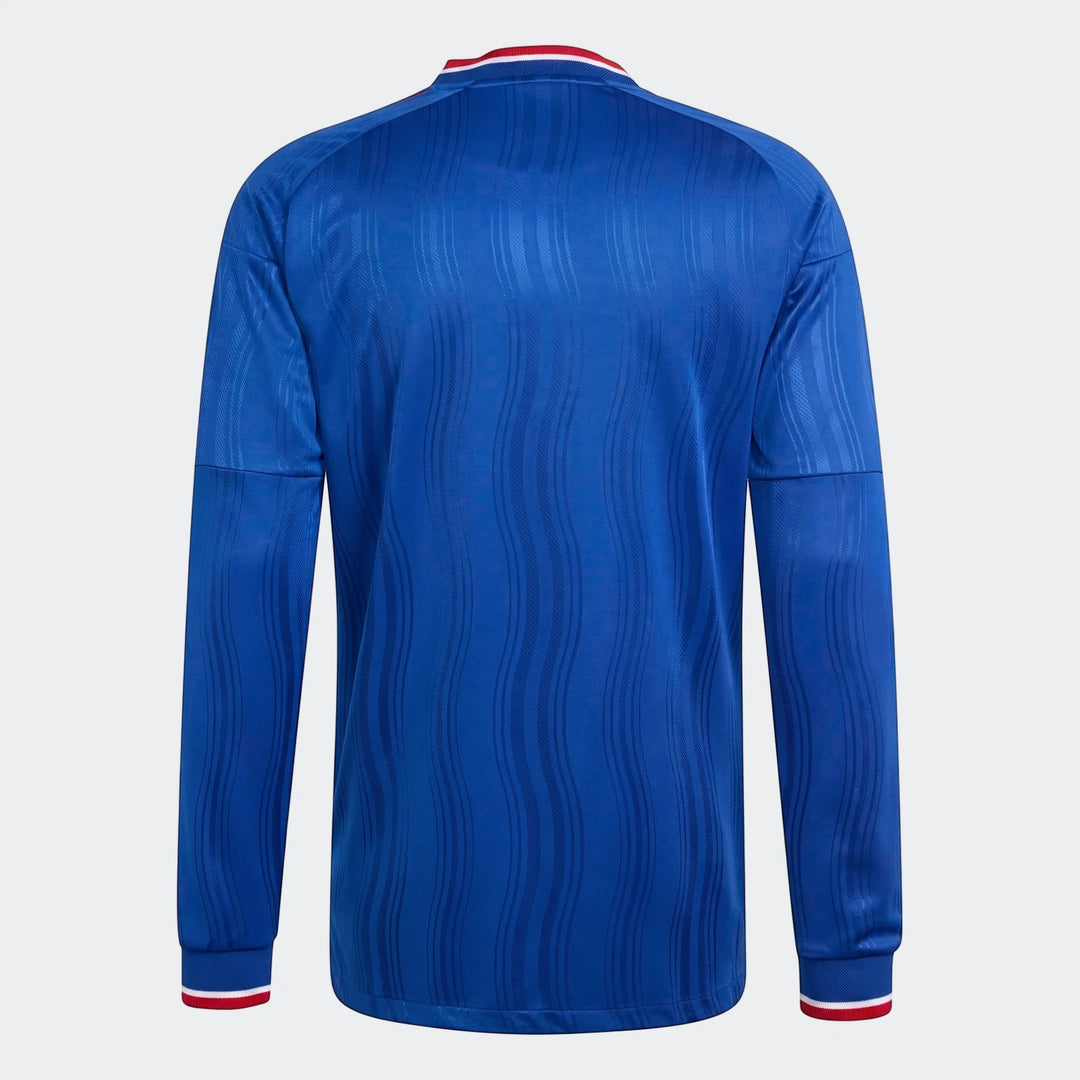 Back view of a blue Manchester United 26/27 Away Authentic Longsleeve Jersey, featuring a subtle wave pattern and red and