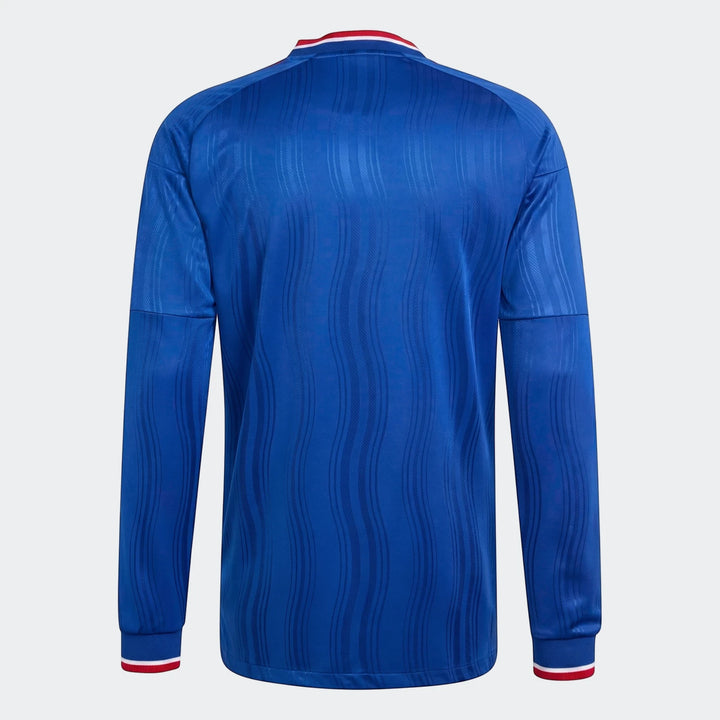 Back view of a blue Manchester United 26/27 Away Authentic Longsleeve Jersey, featuring a subtle wave pattern and red and