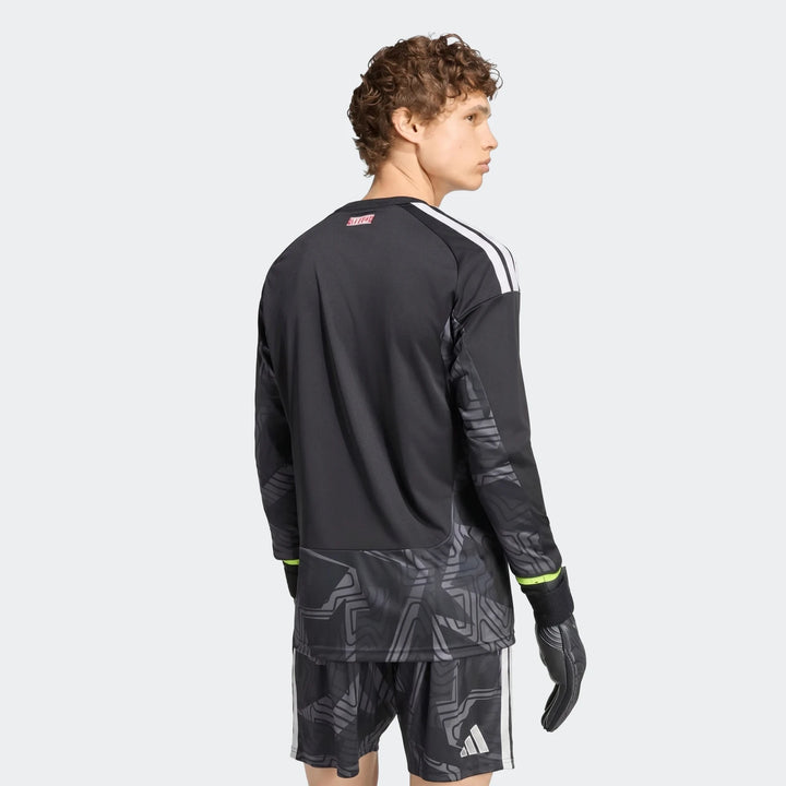 Back view of Manchester United 26/27 long sleeve goalkeeper jersey in black with white shoulder stripes and graphic hem.