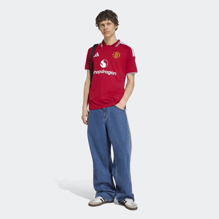 Manchester United 26/27 Home Jersey in red, short-sleeve front view with club crest and white trim collar and cuffs.