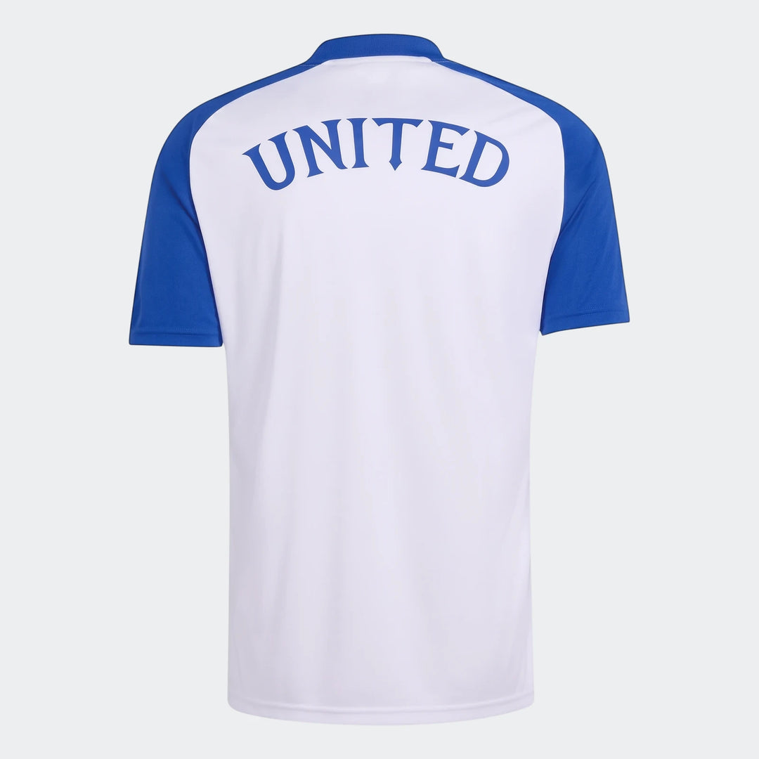 Back view of the Manchester United 26/27 Pre Match Jersey, featuring a white body, royal blue raglan sleeves, and 'UNITED'